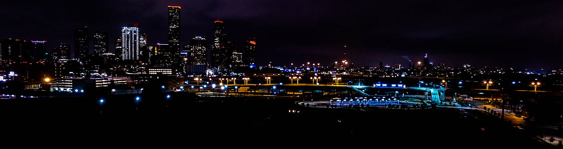 concrete lighted buildings at night time thumbnail