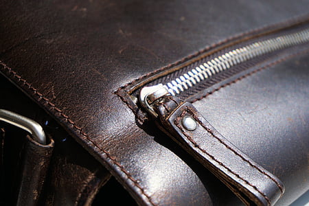 shallow focus photo of brown leather bag thumbnail