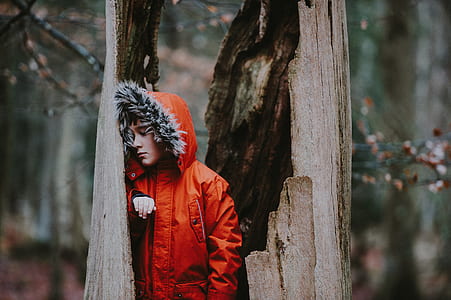 man standing near tree thumbnail