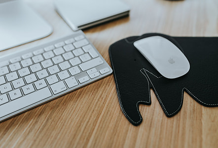 White Apple iMac computer with elephant mousepad thumbnail