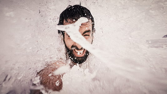 water splashing on man's face thumbnail
