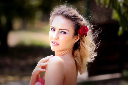 woman with rose on her ears thumbnail
