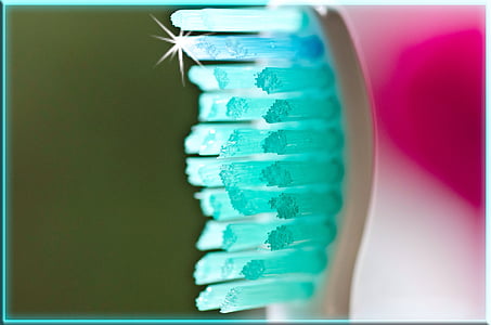 selective focus photography of teal shining toothbrush thumbnail