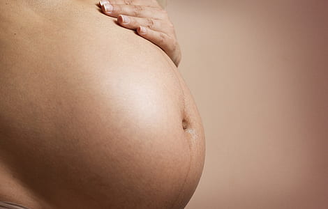 woman's pregnant belly thumbnail