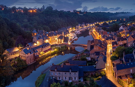 bird's-eye view photography of river between houses thumbnail