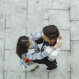 high-angle photography of man and woman hugging at daytime thumbnail