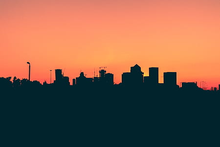 silhouette of buildings at sunset thumbnail