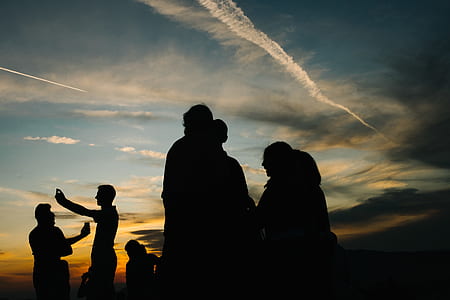 silhouette of person standing during sunset thumbnail