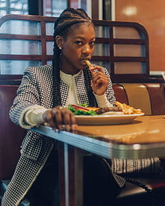 Photo of a Woman Eating at the Restaurant thumbnail