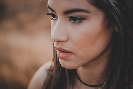 shallow focus photography of black haired woman with black choker thumbnail
