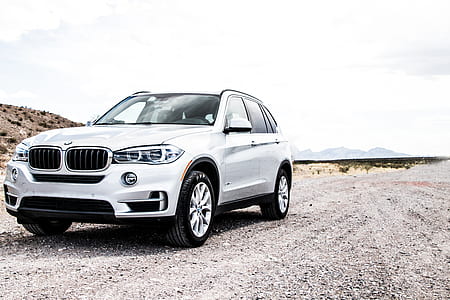 photo of silver BMW SUV on roadway thumbnail