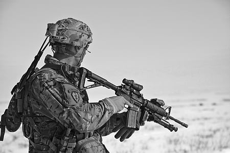 grayscale photo of a soldier holding sniper rifle thumbnail