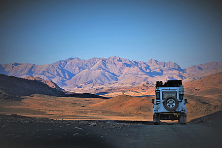 white off road vehicle on gray road path thumbnail