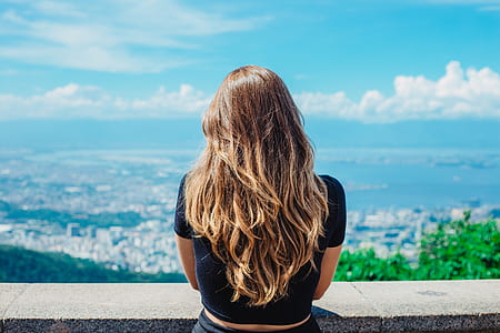 woman looking thru city outdoors thumbnail