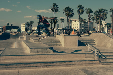 man skateboarding on skateboard field during golden hour thumbnail