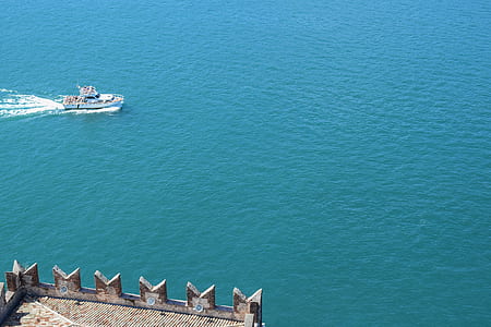 motor boat on body of water thumbnail