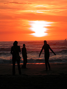 people on seashore while sunset thumbnail