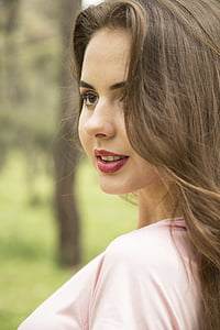 selective focus photography of woman wearing pink shirt with red lipstick thumbnail