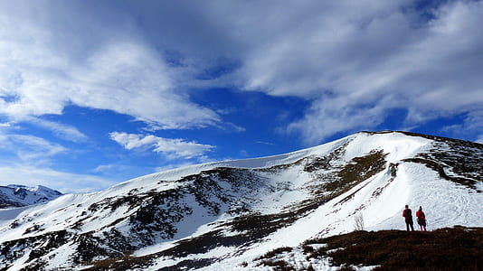 two people on snow-capped mountain thumbnail