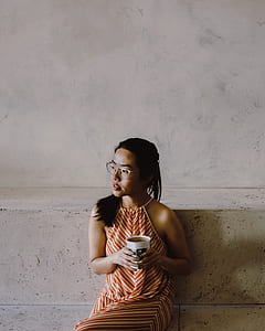 woman holding cup thumbnail