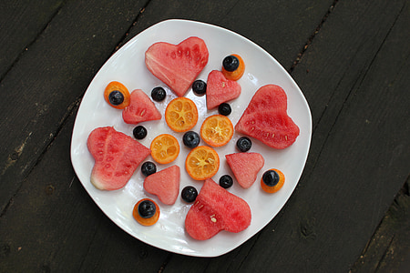 sliced watermelon and orange fruits with olives thumbnail