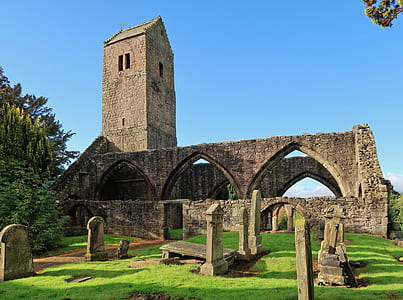 beige brick arch under blue sky thumbnail