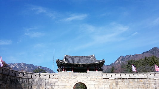 temple and wall under clear day sky thumbnail