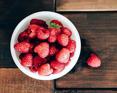 raspberries on white ceramic bowl thumbnail