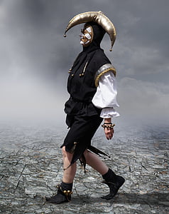 person wearing black, white, and gold jester suit thumbnail