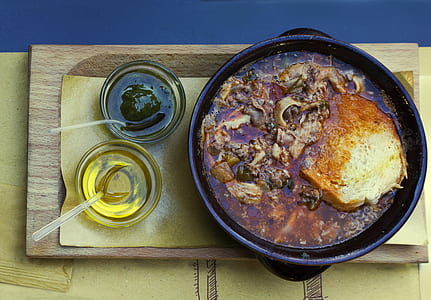 cooked food on skillet near cooking oil thumbnail