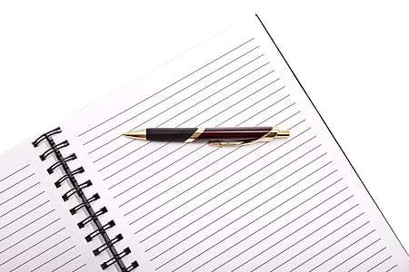 brown and black click pen on white ruled paper thumbnail