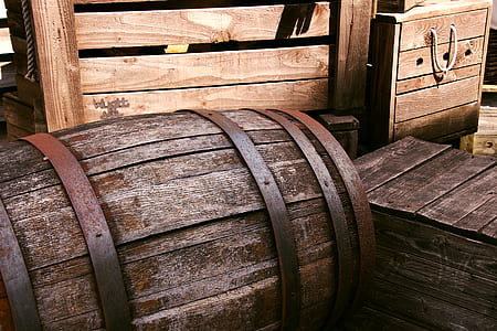 brown wooden barrel near board thumbnail