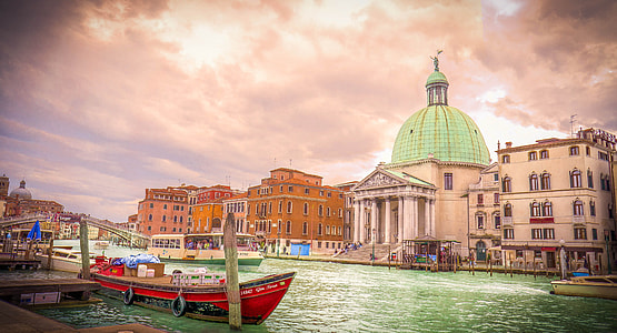 green and beige painted dome building near the river thumbnail