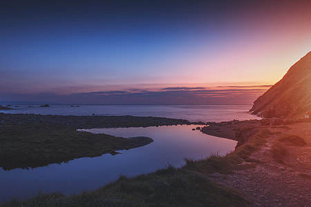 Sunset landscape shot taken at Duckpool Beach in Cornwall, England thumbnail