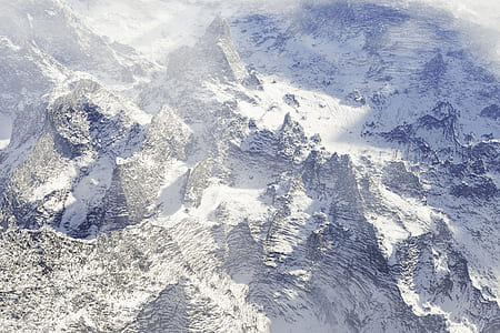 snow capped rocky mountain during daytime thumbnail