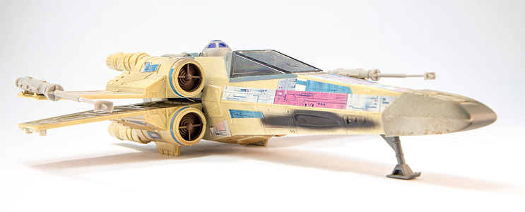 photo of yellow Star Wars fighter plane toy thumbnail