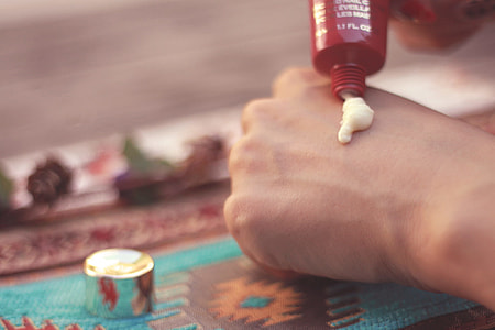 white cream on person's hand thumbnail