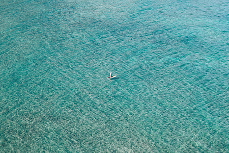 top view photo of boat on body of water thumbnail