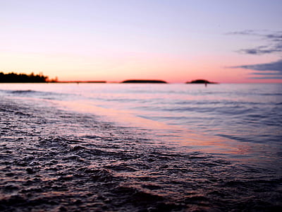 selective focus photography of retreating sea waves thumbnail