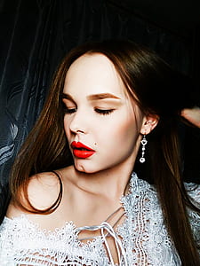 woman holding her hair wearing off-shoulder top thumbnail
