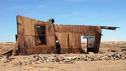 brown wooden house frame photo taken during daytime thumbnail