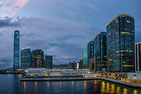 architectural photography of buildings near body of water thumbnail