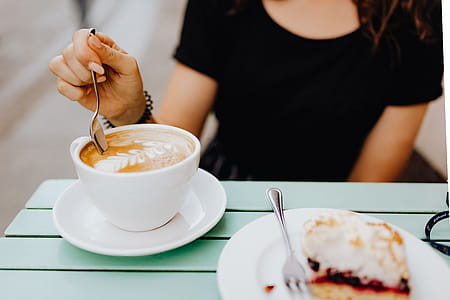 Drinking coffee and eating cake in a cafeteria thumbnail