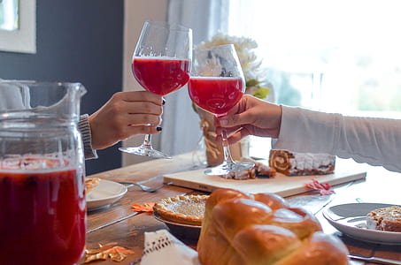 two person tossing wine glasses thumbnail