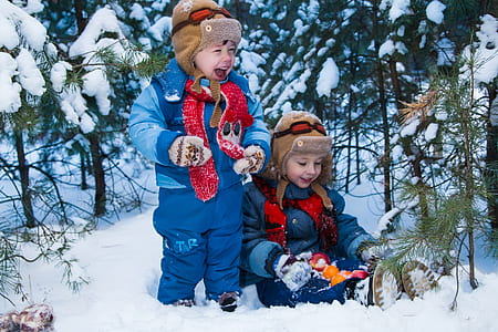 two boys playing on snow thumbnail