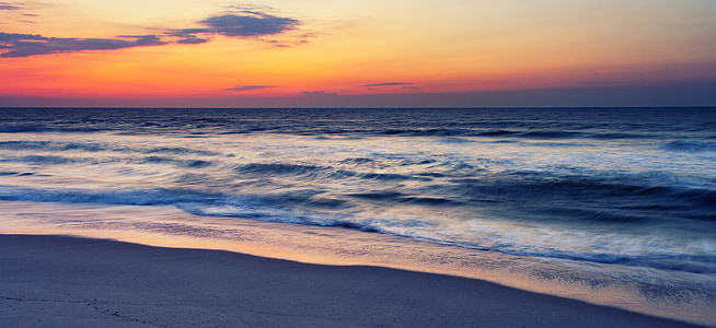 seashore under clear sky at golden hour thumbnail