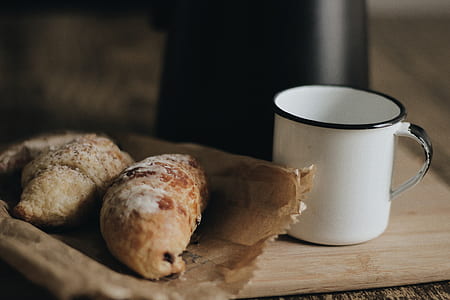 shallow focus photography of pastry on paper bag thumbnail