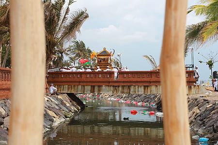 brown temple near body of water thumbnail