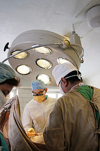 three men inside white concrete room thumbnail