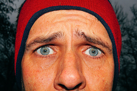 closeup photo of a man wearing blue and red bubble cap thumbnail